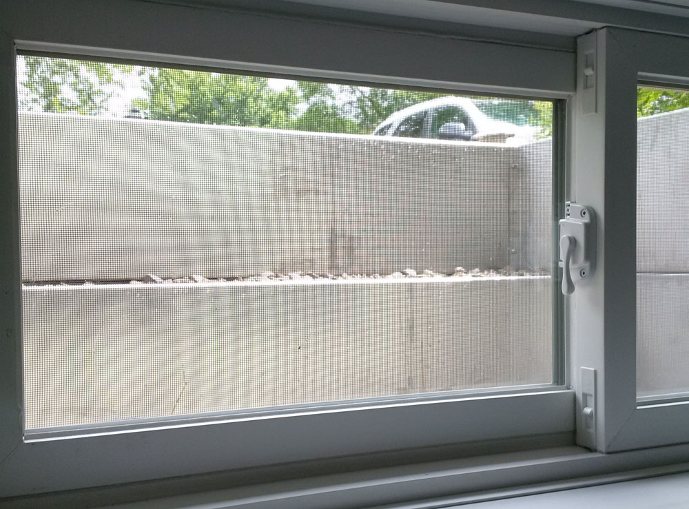 Modern Square Stainless Steel Egress Window Well from basement interior